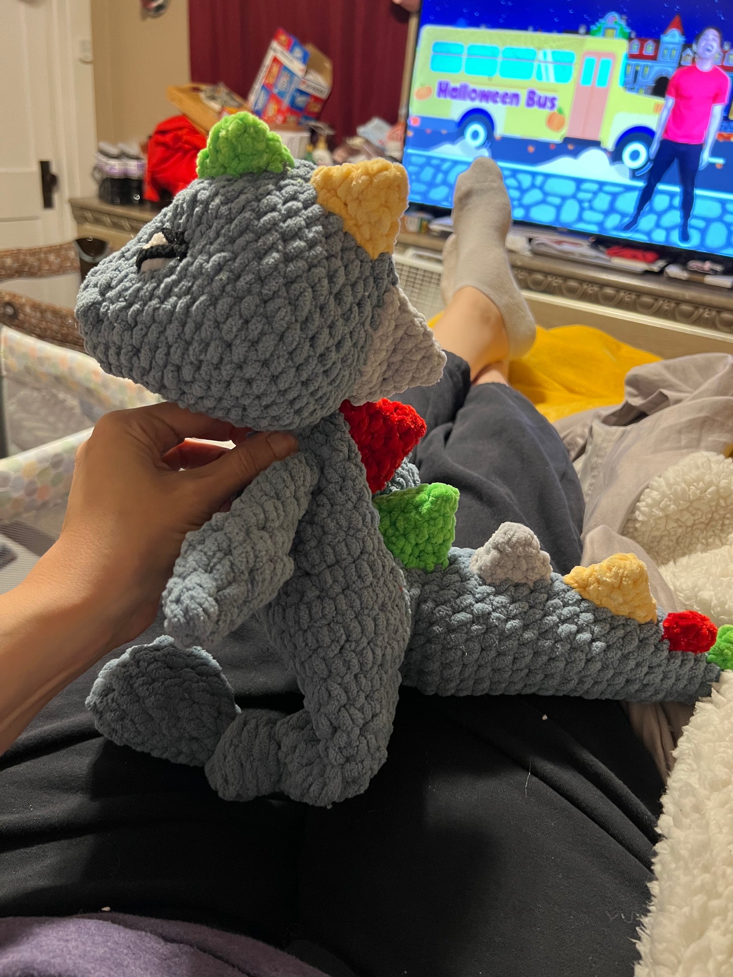 Dino Snuggler – Light Blue with Colorful Spikes