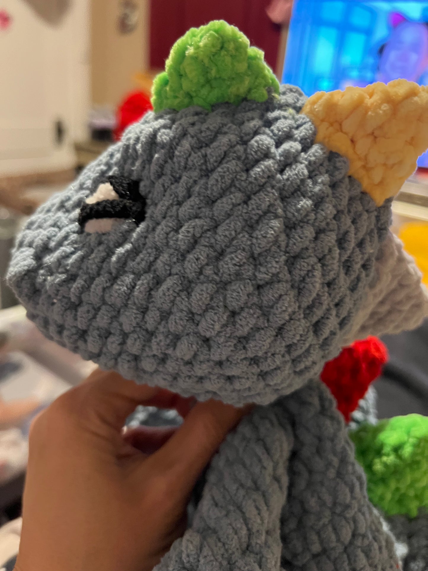 Dino Snuggler – Light Blue with Colorful Spikes