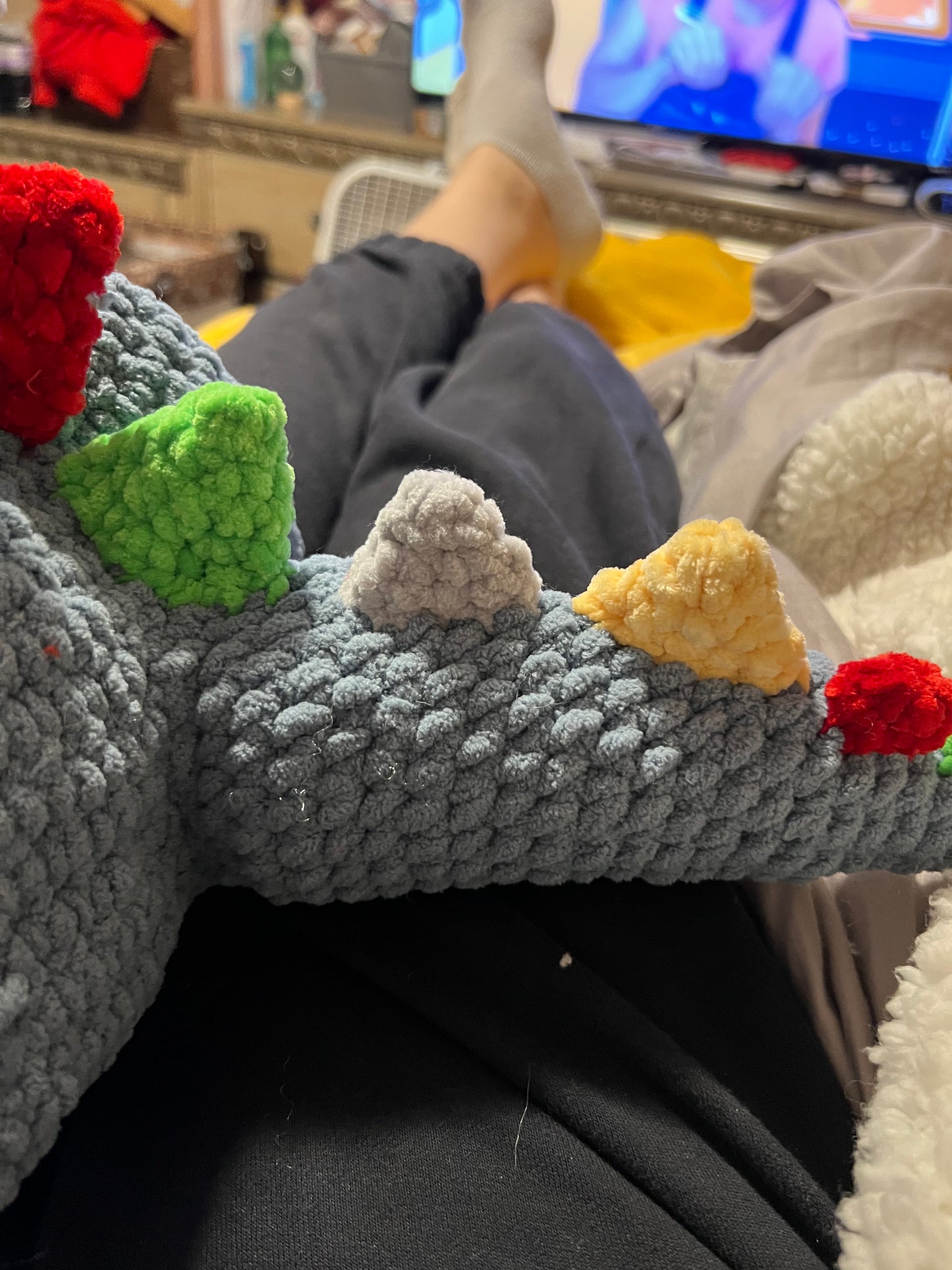 Dino Snuggler – Light Blue with Colorful Spikes