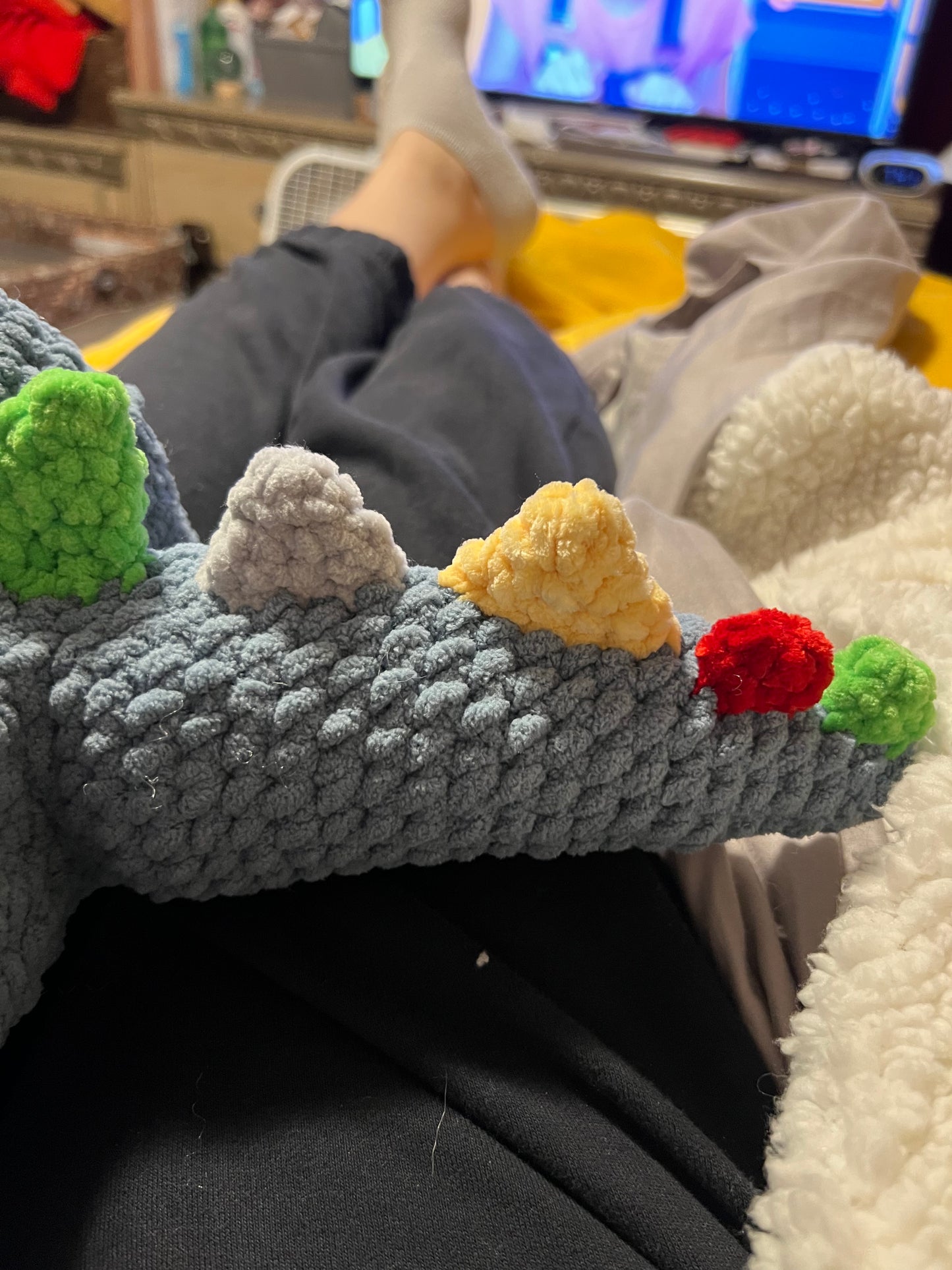 Dino Snuggler – Light Blue with Colorful Spikes